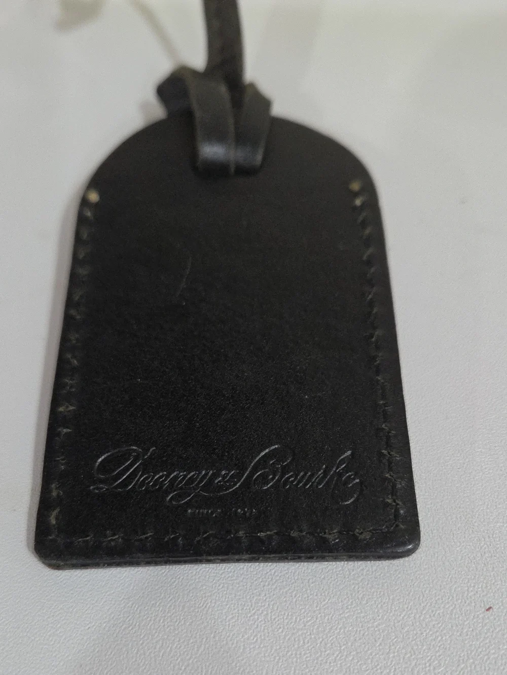 Dooney & Bourke Black Leather Tag with Embossed Logo